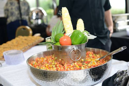 Fresh corn salsa served in a rustic bucket display