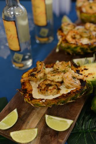 Shrimp cocktail served in a hollowed pineapple