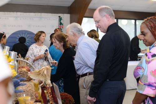 Guests mingling near the Strive Senior Living booth