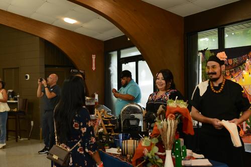 Guests admiring a Day of the Dead themed booth