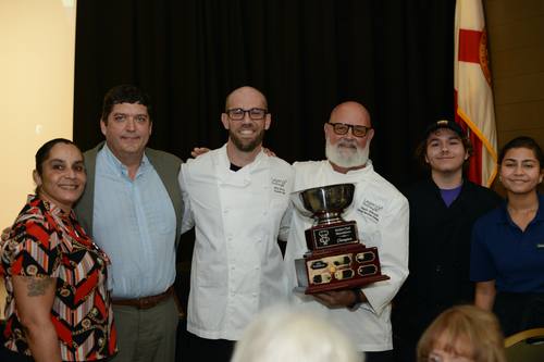 Legacy Pointe executive chef accepting the Champion trophy