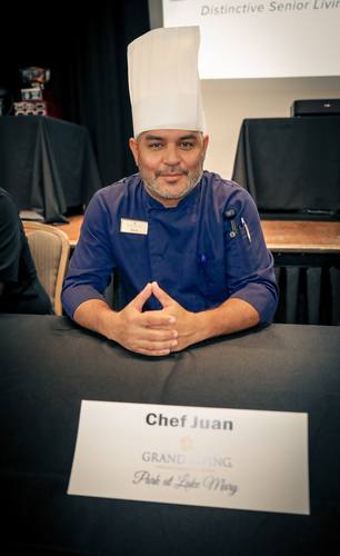 Chef Kevin of The Grove at Trelago, arms crossed, tattoos visible