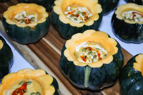 Creative dessert served inside a hollowed acorn squash